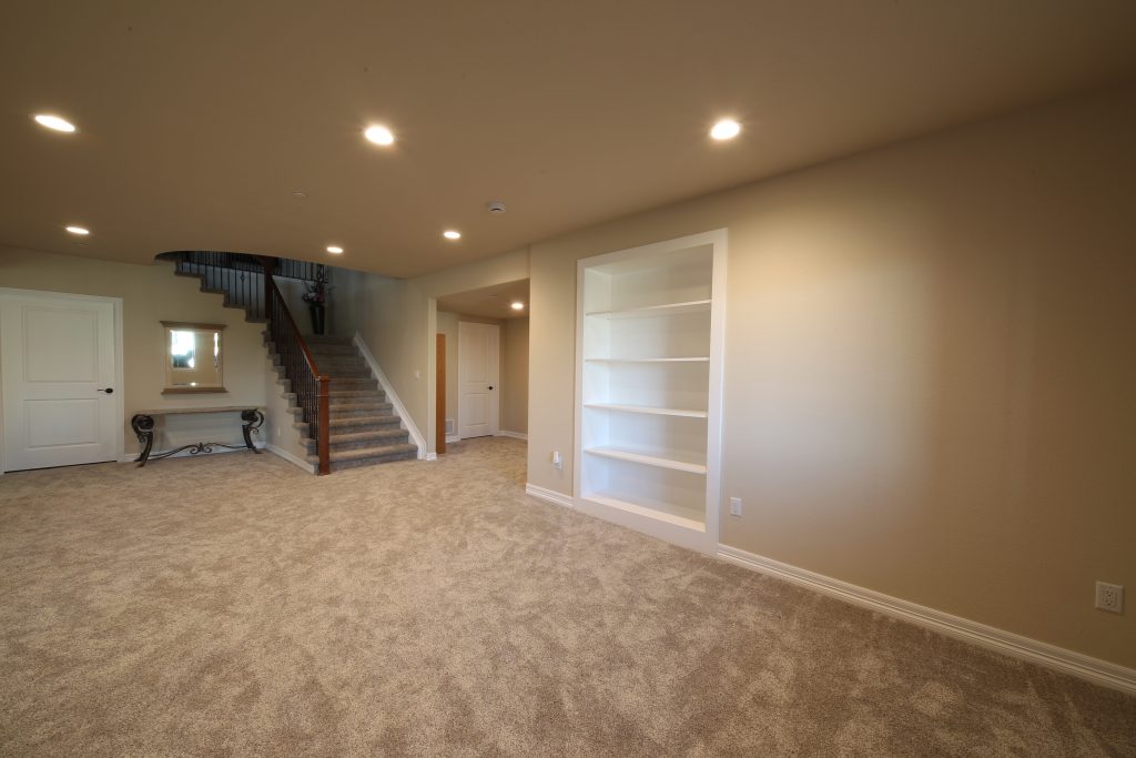 CD8G0054 Colorado Beach St, basement finish. Includes new carpeting, modern lighting, built-in shelving.